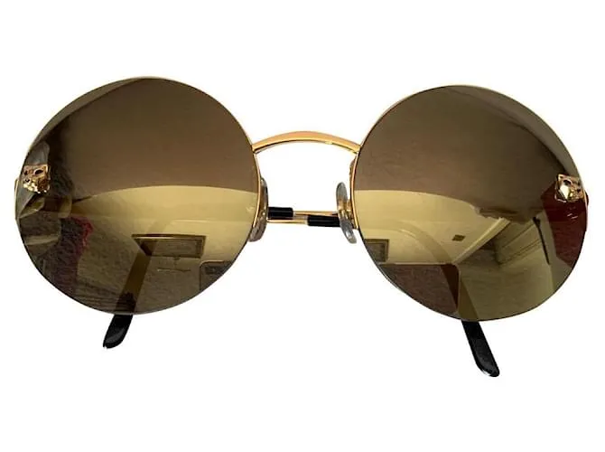 Cartier Lentes de sol Dorado 