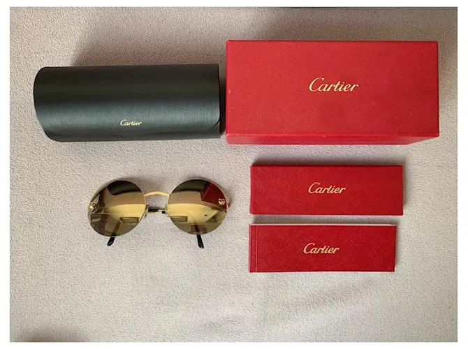 Cartier Lentes de sol Dorado 