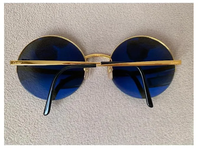 Cartier Lentes de sol Dorado 