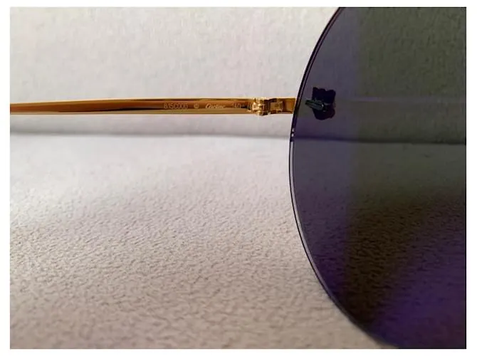 Cartier Lentes de sol Dorado 