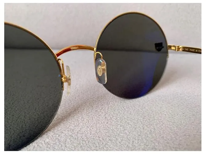 Cartier Lentes de sol Dorado 