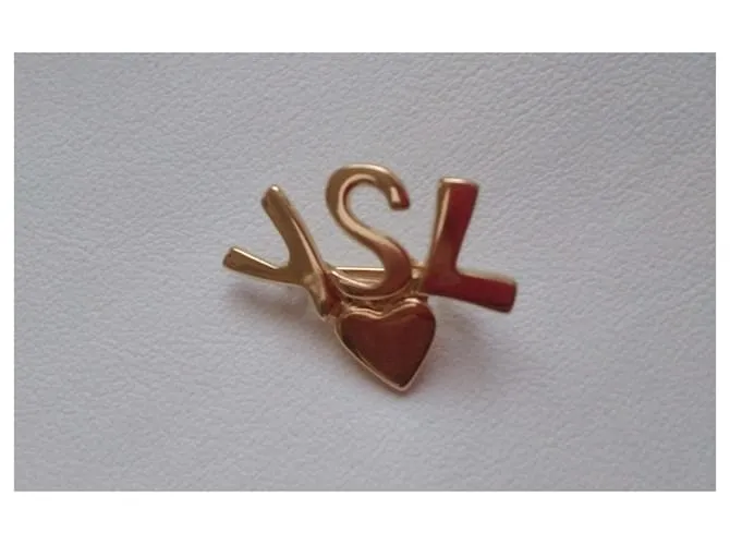 Yves Saint Laurent Pins y broches Dorado 